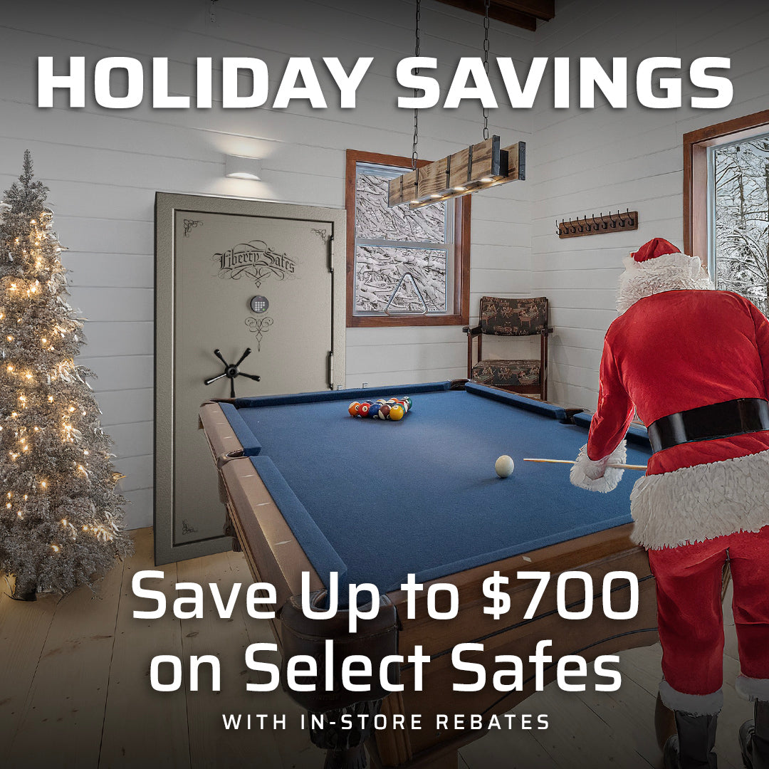Holiday savings promotion featuring a Liberty Safe in a game room with Santa playing pool, advertising up to $700 off select safes with in-store rebates.